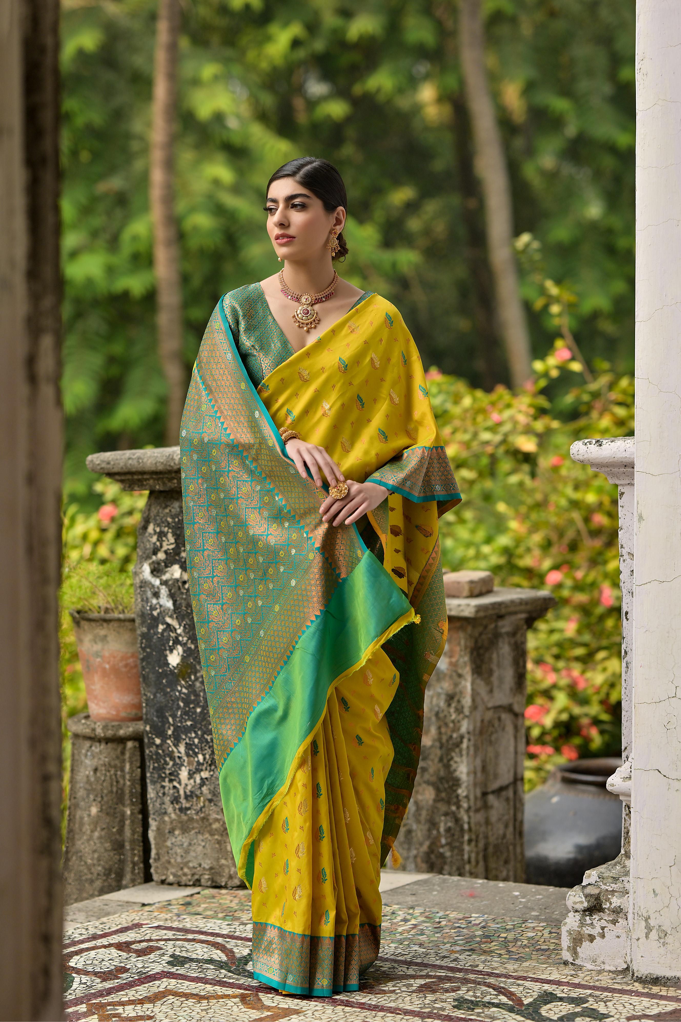 Luxurious Yellow Woven Banarasi Saree with Intricate Zari Motifs